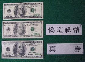 2 arrested for alleged smuggling of fake U.S. dollars